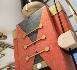 Orion fabricates 2 giant crystal encrusted toy soldiers that flank the cash wrap, alongside sparkling signage and red velvet drapes embellished with Crystals from Swarovski