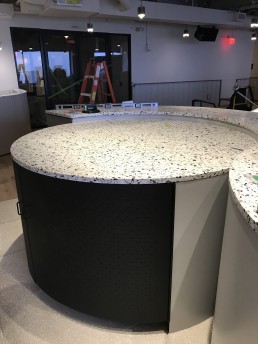Orion was brought in to produce custom millwork, stone and seating for a new WeWork location in Boston