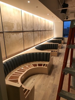Orion was brought in to produce custom millwork, stone and seating for a new WeWork location in Boston